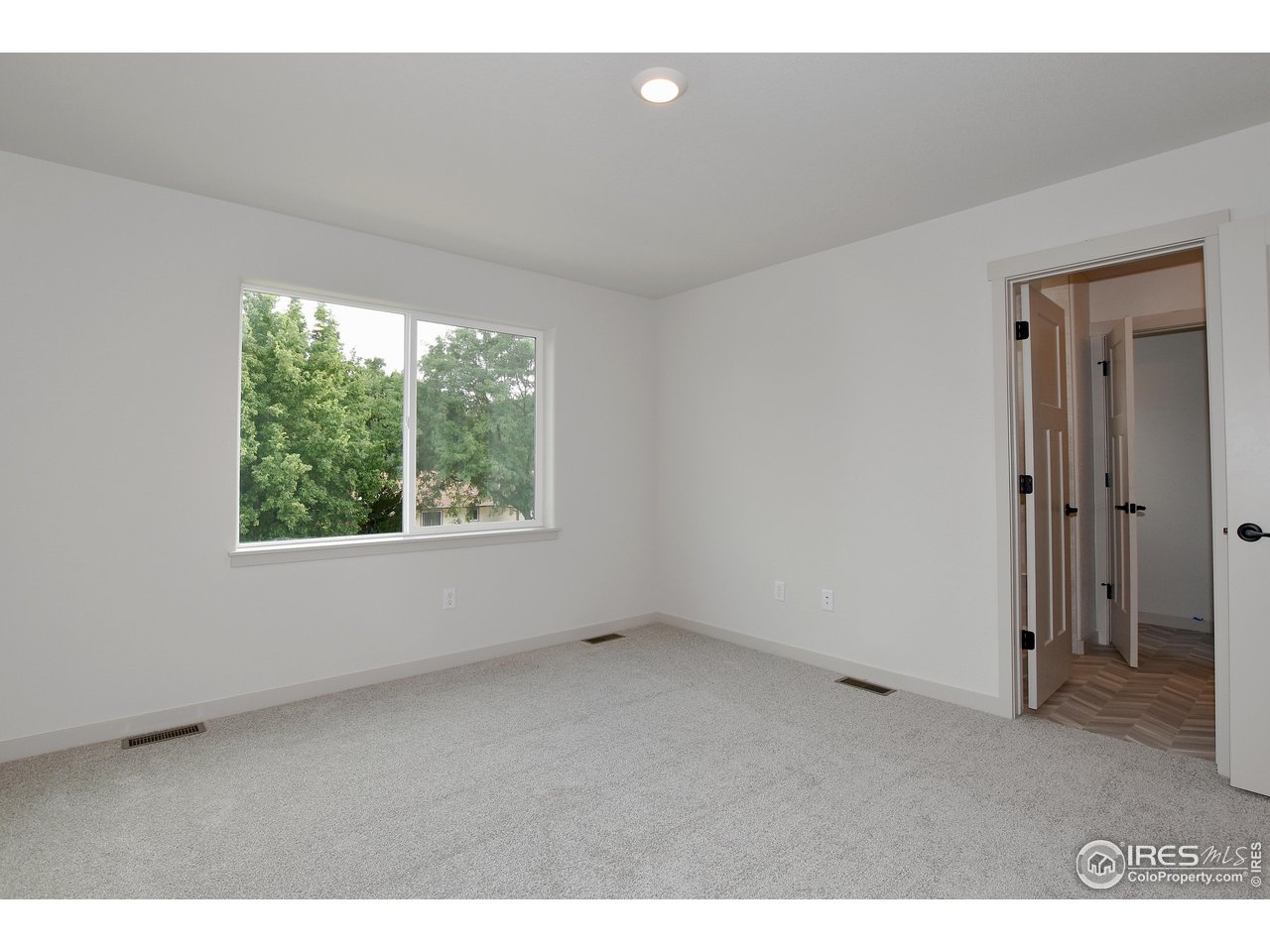 268 East 4th Street Berthoud, CO 80513 - Photo 22 of 39 a view of an empty room with a window