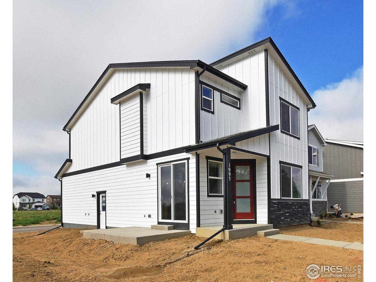 268 East 4th Street Berthoud, CO 80513 - Photo 3 of 39 a view of a house with large windows
