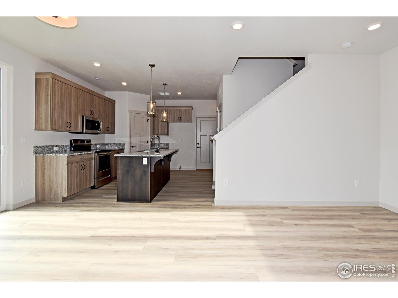 268 East 4th Street Berthoud, CO 80513 - Photo 5 of 39 a view of kitchen with microwave and cabinets
