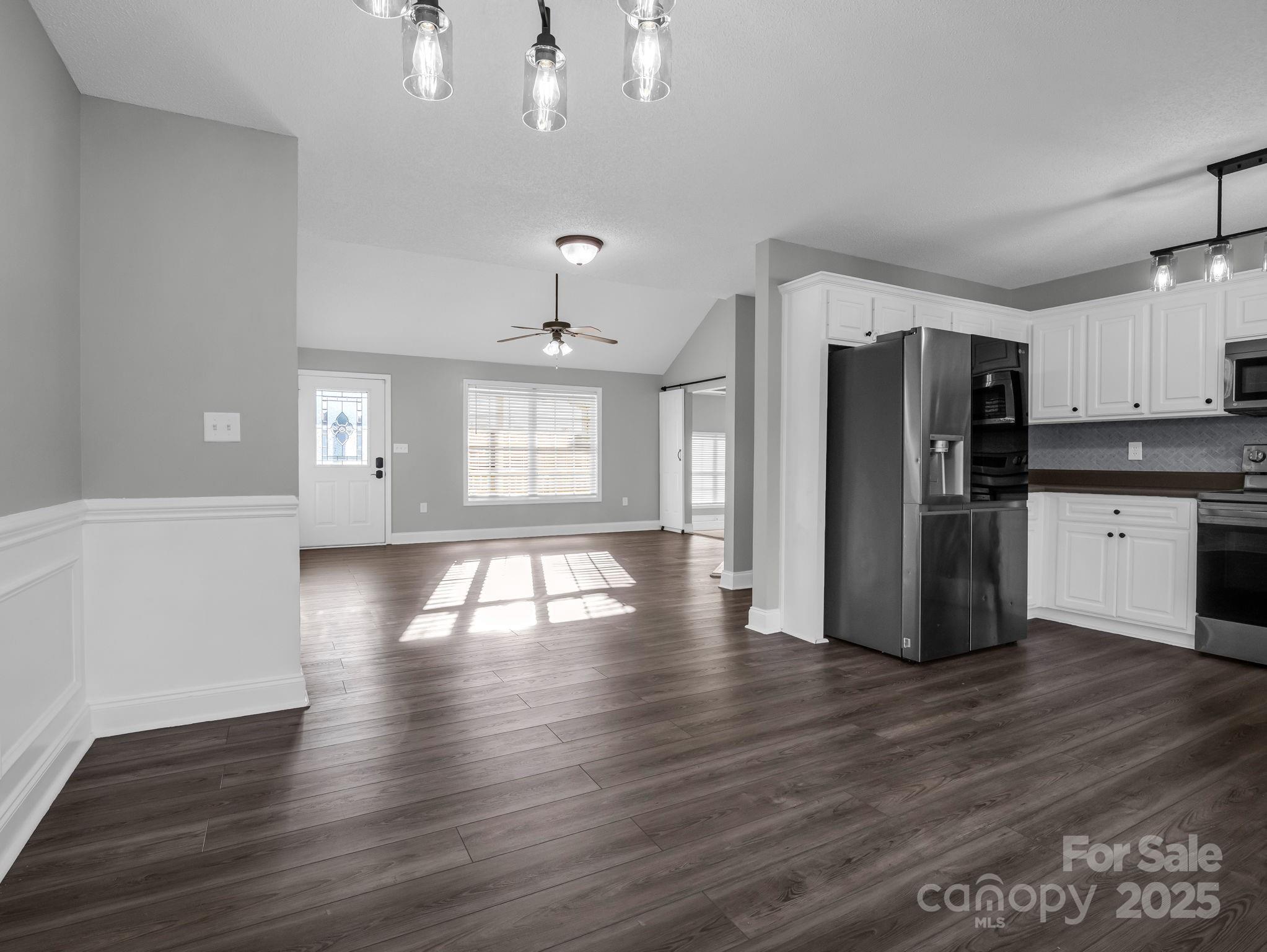 340 Sarratt Creek Road Gaffney, SC 29341 - Photo 15 of 46 a view of a kitchen with a refrigerator and wooden floor