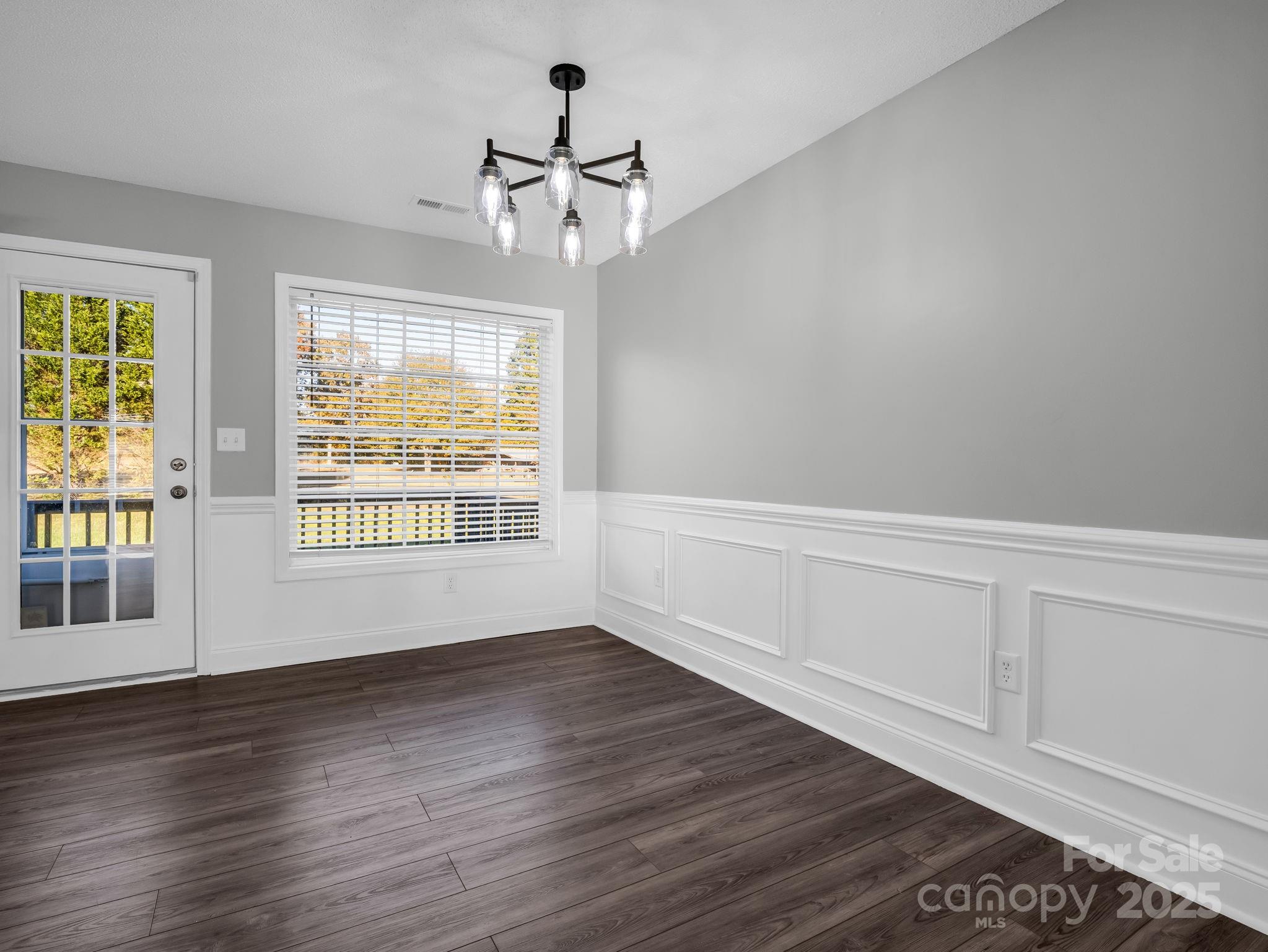 340 Sarratt Creek Road Gaffney, SC 29341 - Photo 16 of 46 a view of an empty room with wooden floor and a window