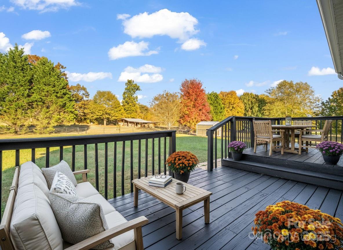 340 Sarratt Creek Road Gaffney, SC 29341 - Photo 2 of 46 a balcony with wooden floor and outdoor seating