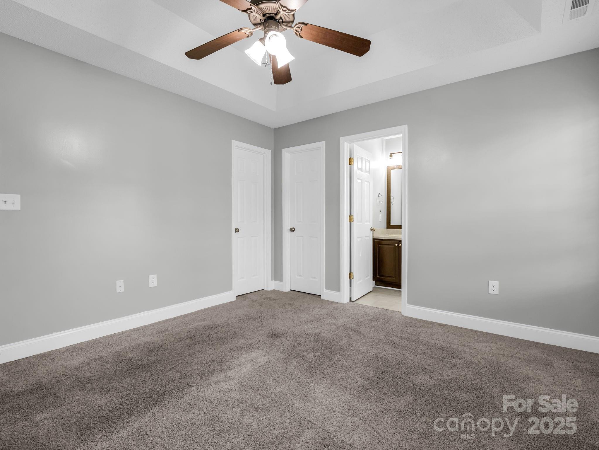 340 Sarratt Creek Road Gaffney, SC 29341 - Photo 29 of 46 an empty room with a chandelier fan and windows