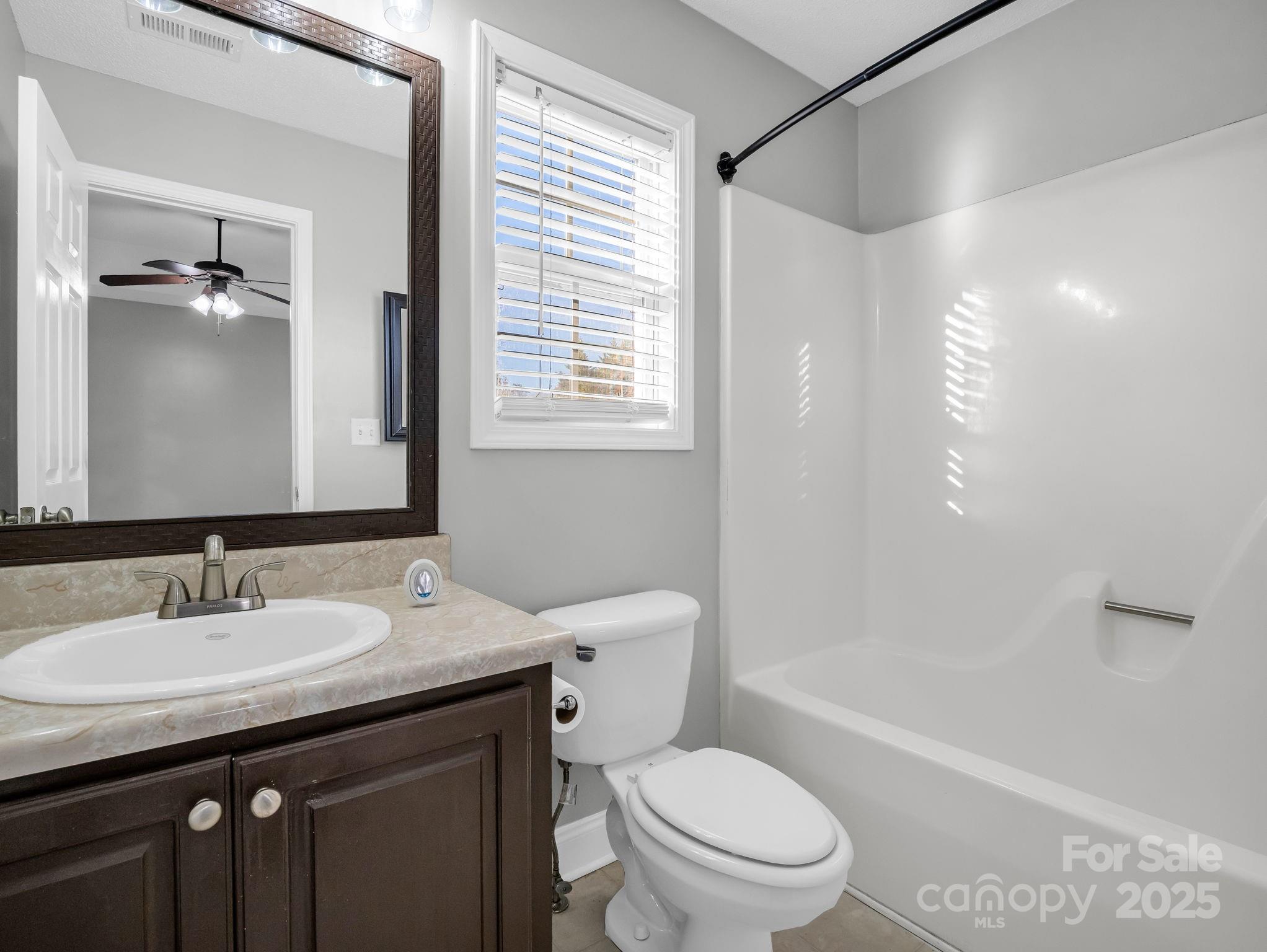 340 Sarratt Creek Road Gaffney, SC 29341 - Photo 30 of 46 a bathroom with a granite countertop sink toilet and shower