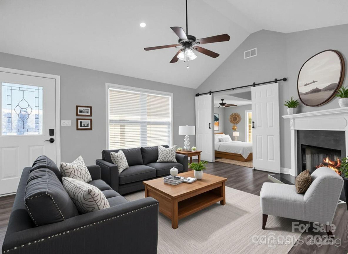 340 Sarratt Creek Road Gaffney, SC 29341 - Photo 4 of 46 a living room with furniture a rug a window and a fireplace