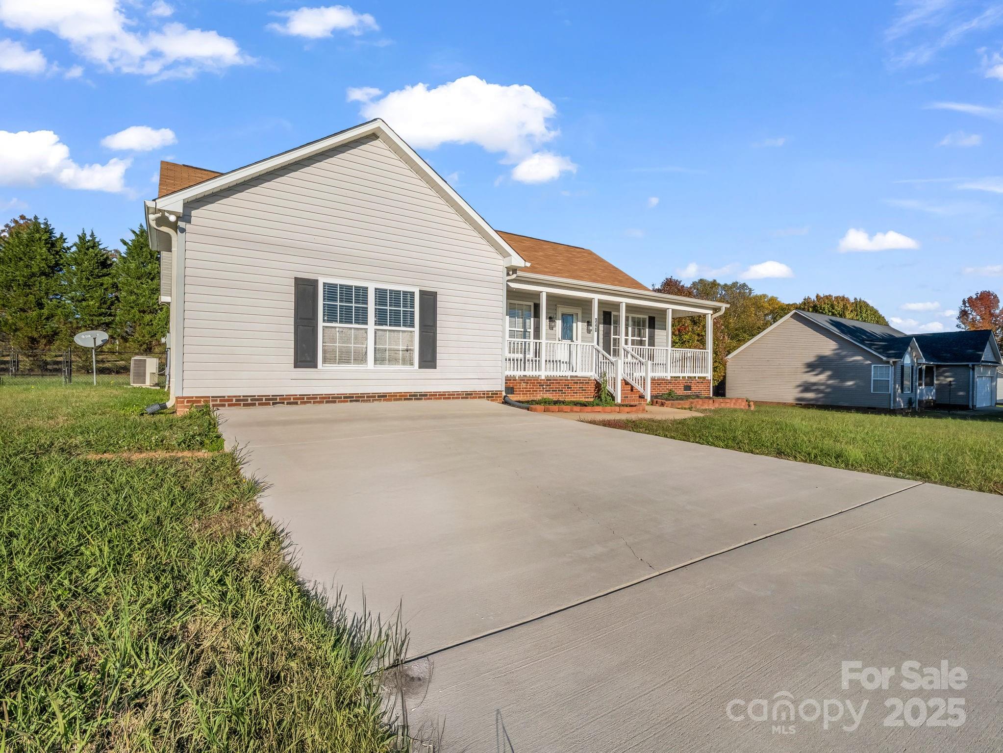 340 Sarratt Creek Road Gaffney, SC 29341 - Photo 46 of 46 a front view of a house with a garden and plants