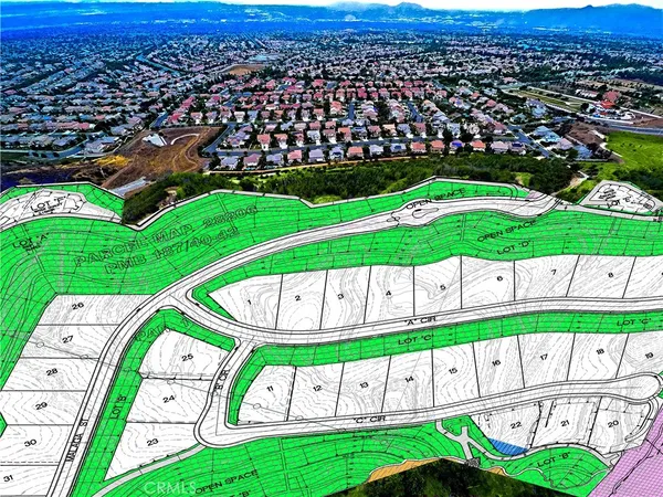 an aerial view of a house with a garden and deck