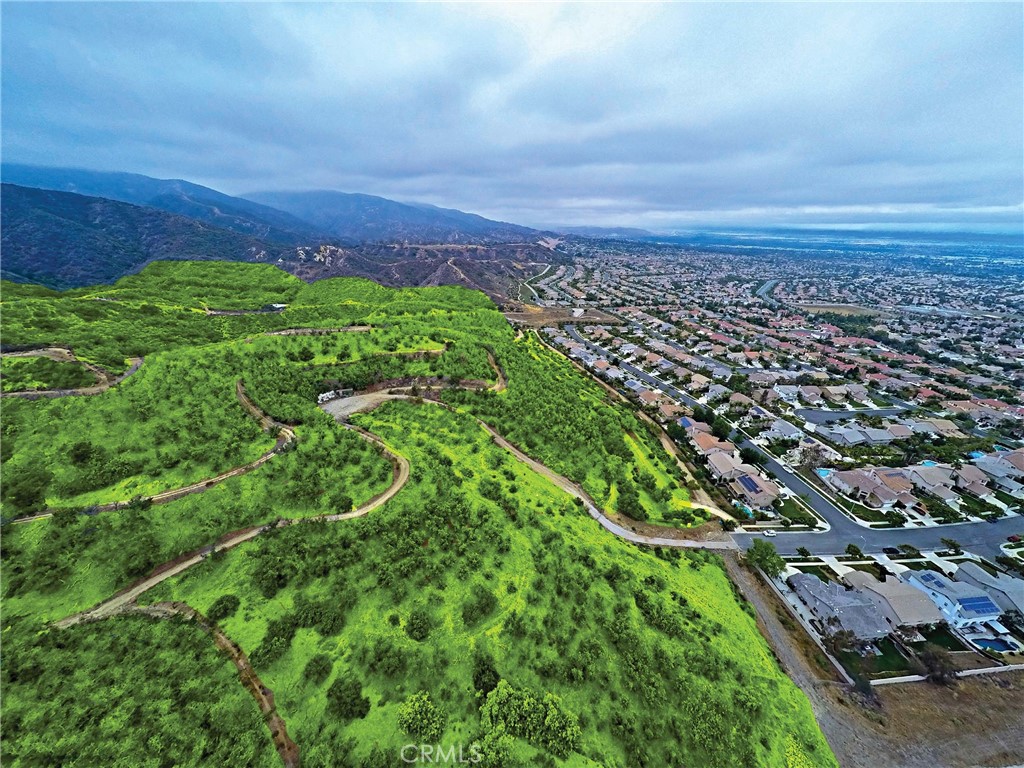 3933 Malaga Street Corona, CA 92882 - Photo 5 of 18 an aerial view of residential building with green space
