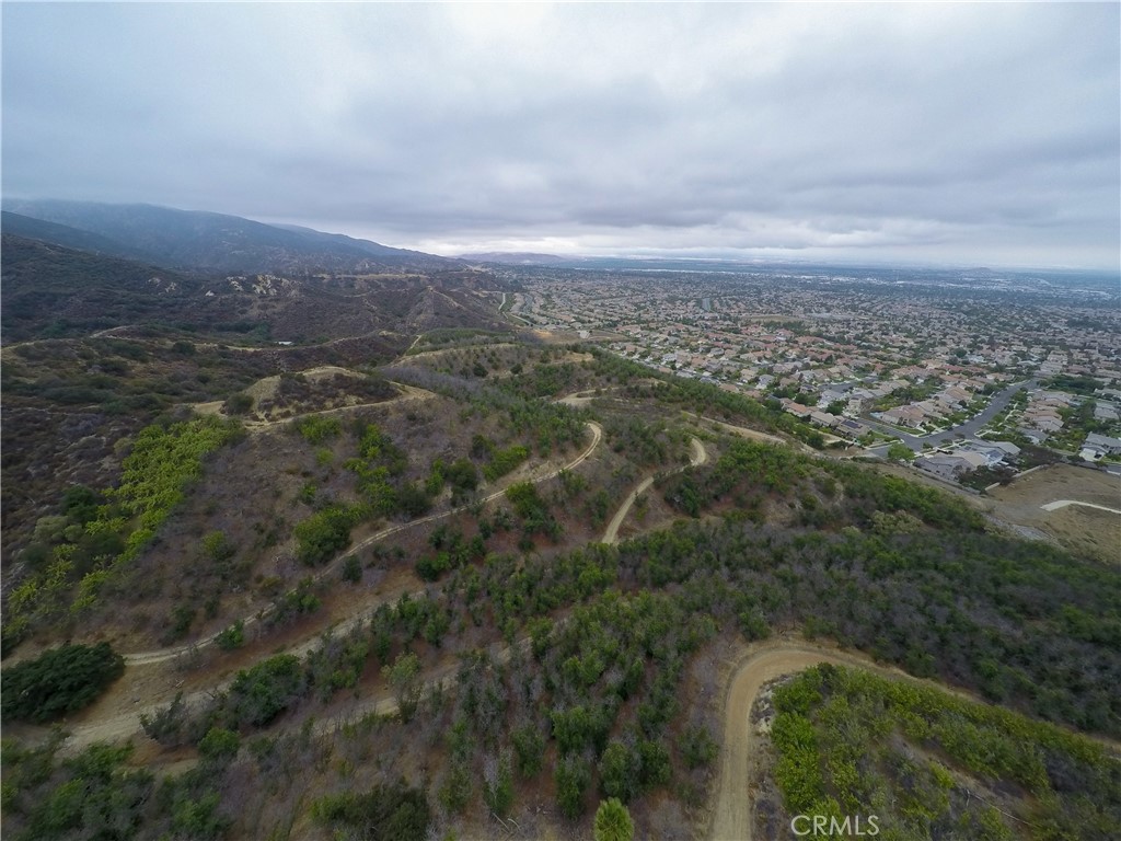 3933 Malaga Street Corona, CA 92882 - Photo 7 of 18 an aerial view of residential houses with outdoor space and trees