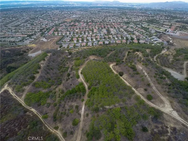 an aerial view of a houses with a yard