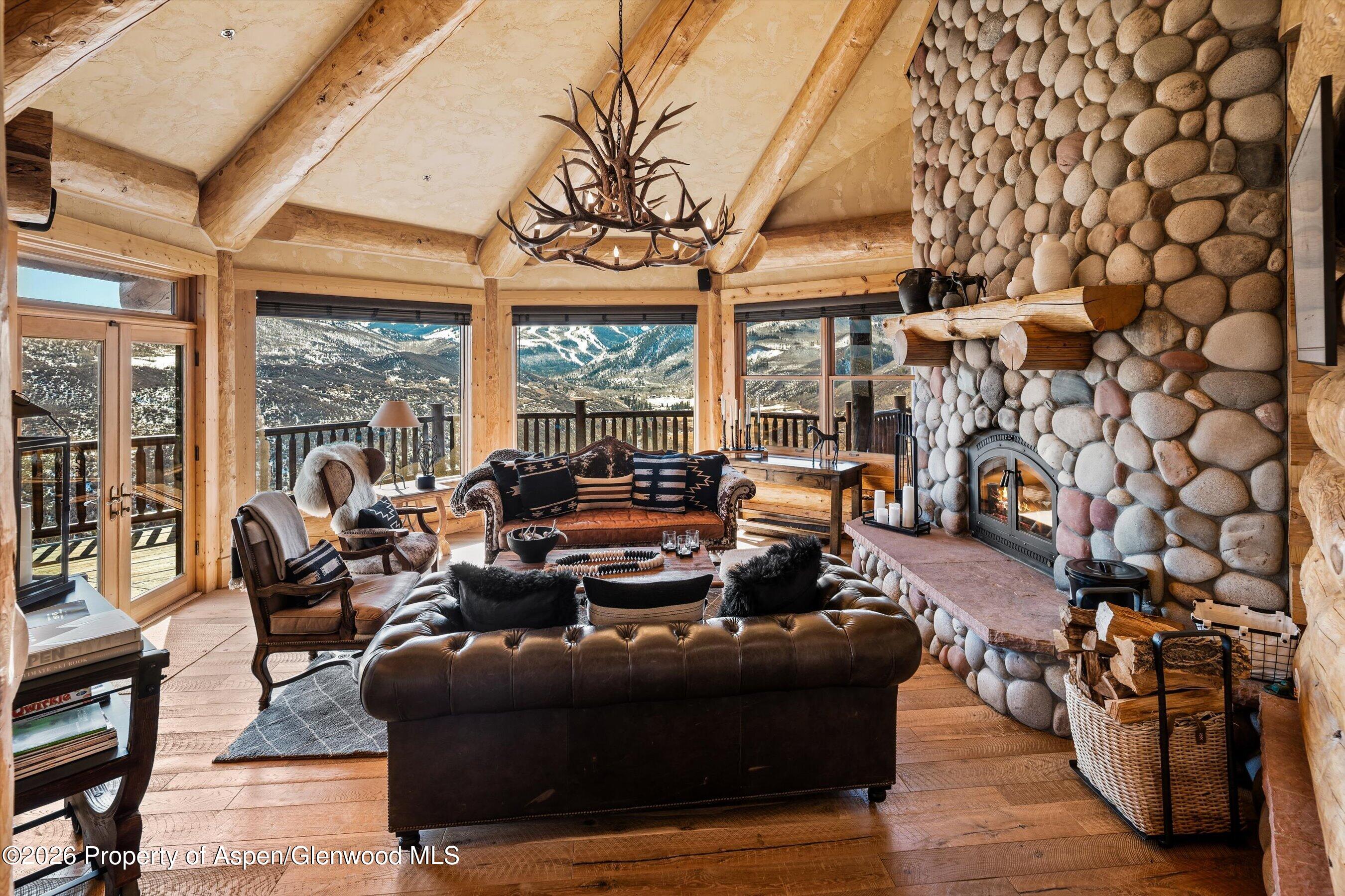 1450 Mesa Road Snowmass, CO 81654 - Photo 6 of 49 3LivingRoomFireplace