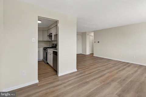 a view of kitchen and wooden floor