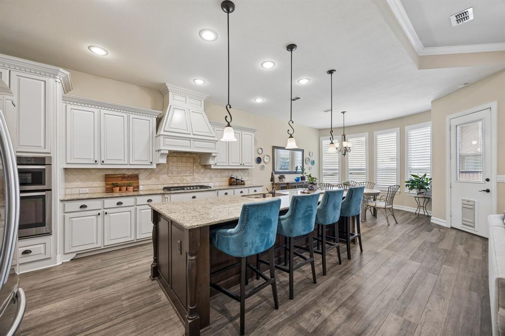 948 Holt Lane Allen, TX 75013 - Photo 10 of 40 Plenty of extra seating at spacious kitchen island