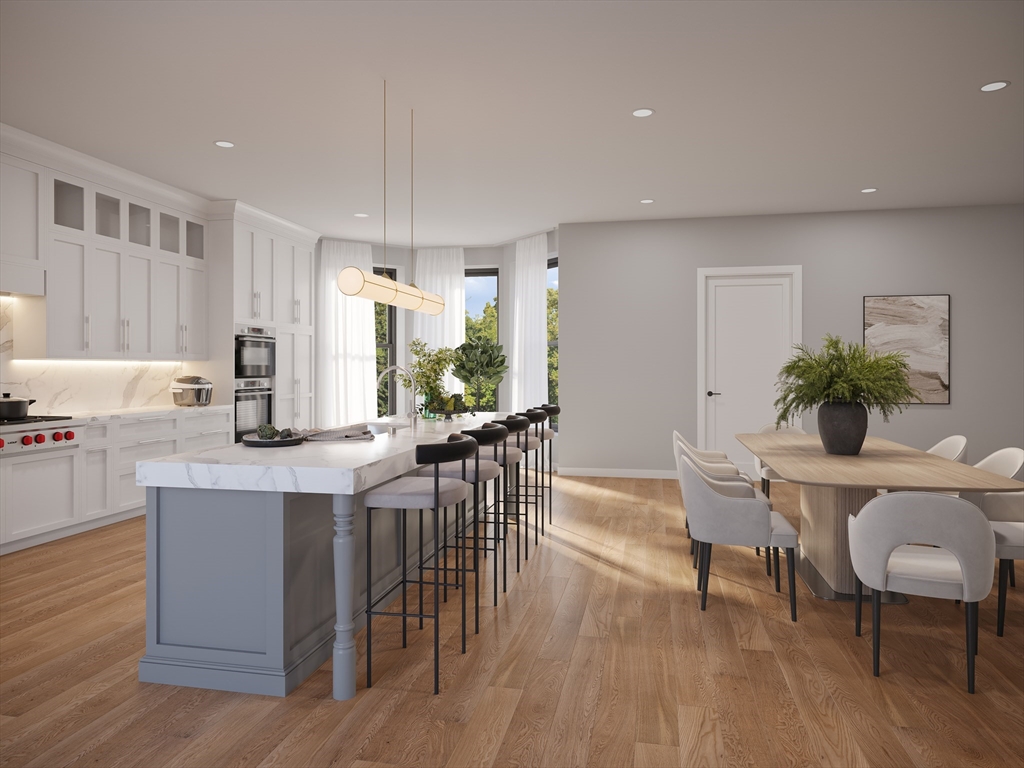 323 Commonwealth Avenue, Unit 1 Boston, MA 02115 - Photo 3 of 6 a kitchen with a table and chairs in it