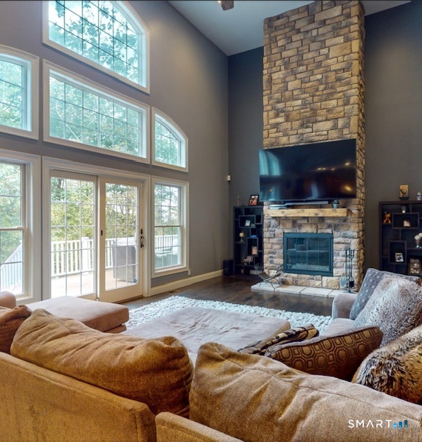 4 Southdown Drive Bristol, CT 06010 - Photo 17 of 40 a living room with furniture large window and a fireplace