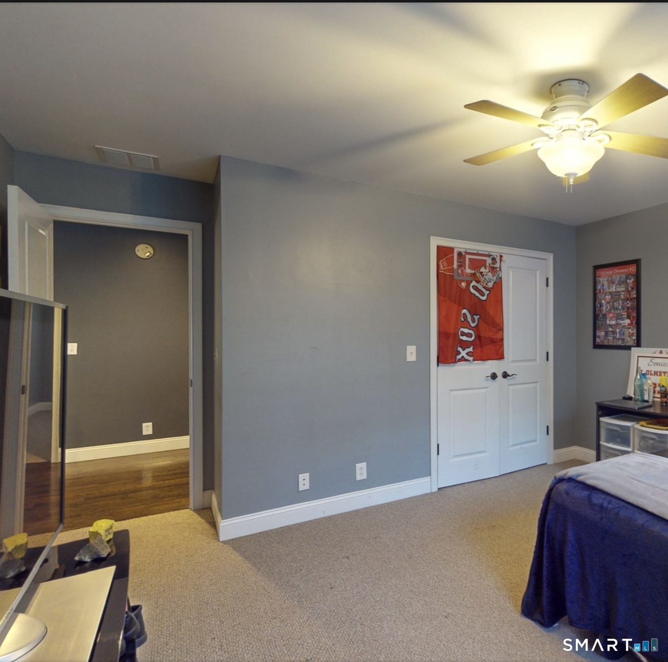 4 Southdown Drive Bristol, CT 06010 - Photo 36 of 40 a bedroom with a bed and a chandelier