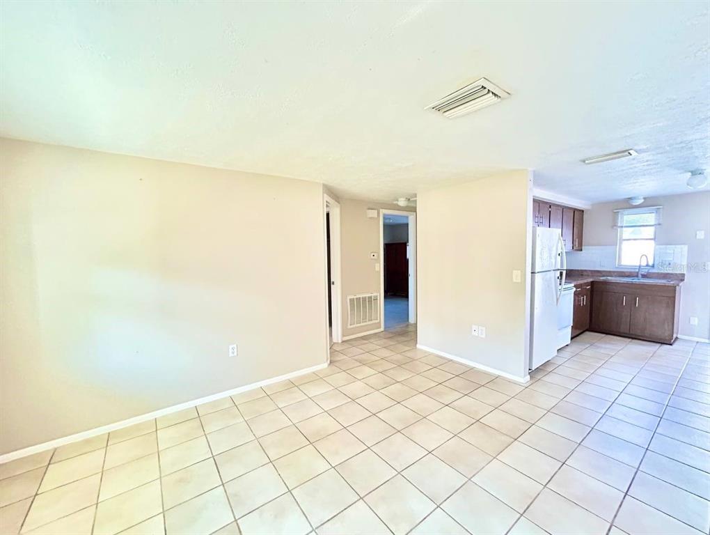 5805 Delaware Avenue New Port Richey, FL 34652 - Photo 3 of 12 a view of a kitchen with kitchen