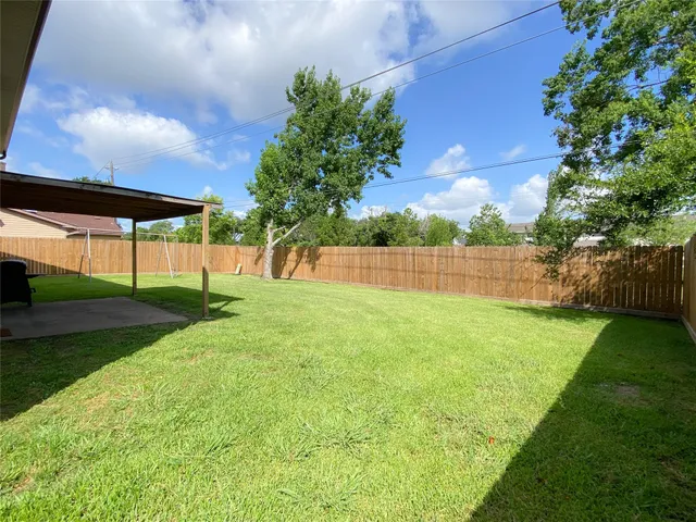 a view of backyard with green space