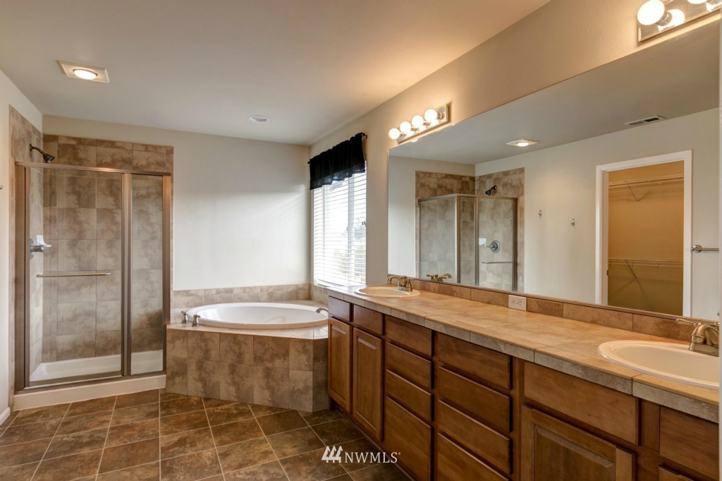 16123 35th Drive Southeast Bothell, WA 98012 - Photo 6 of 13 a bathroom with a double vanity sink mirror and bathtub