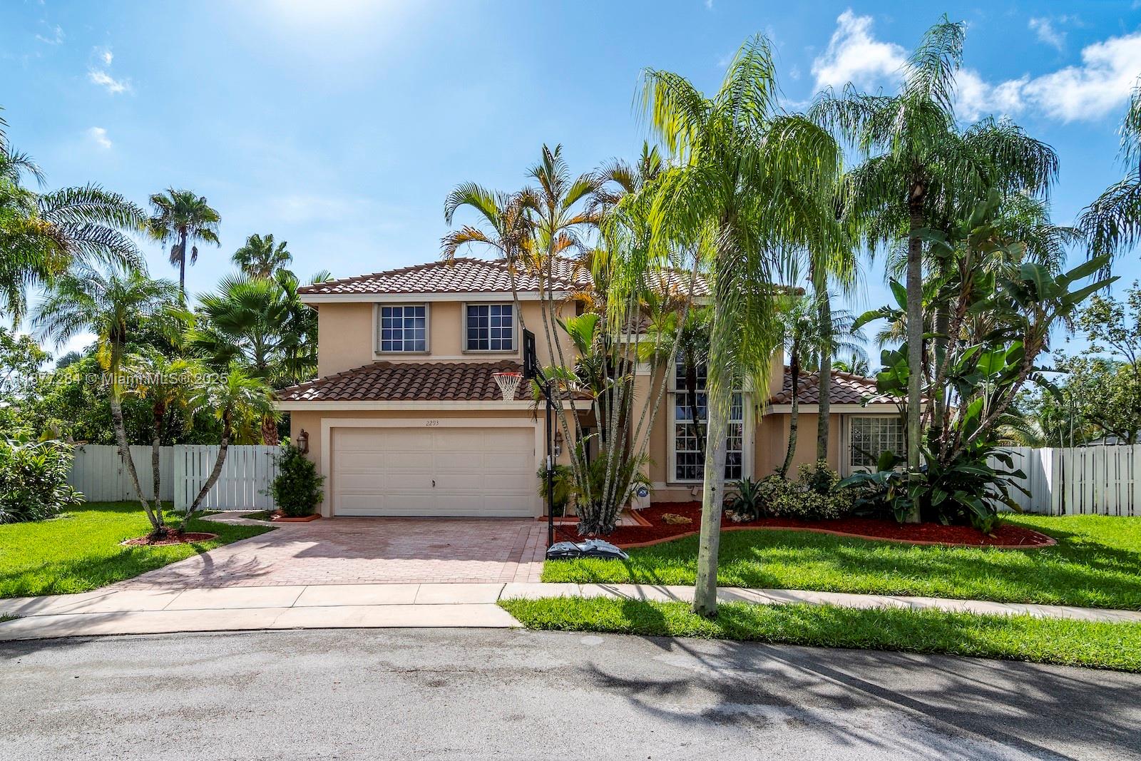 2293 Southwest 182nd Way Miramar, FL 33029 - Photo 1 of 41 a front view of a house with a yard and a garage