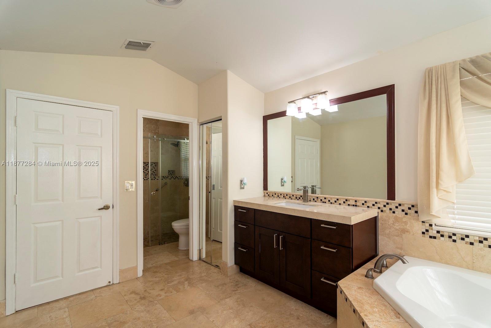 2293 Southwest 182nd Way Miramar, FL 33029 - Photo 21 of 41 a spacious bathroom with a double vanity sink mirror and double