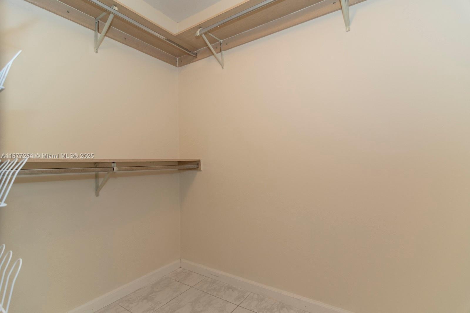 2293 Southwest 182nd Way Miramar, FL 33029 - Photo 23 of 41 a view of a room with shelf