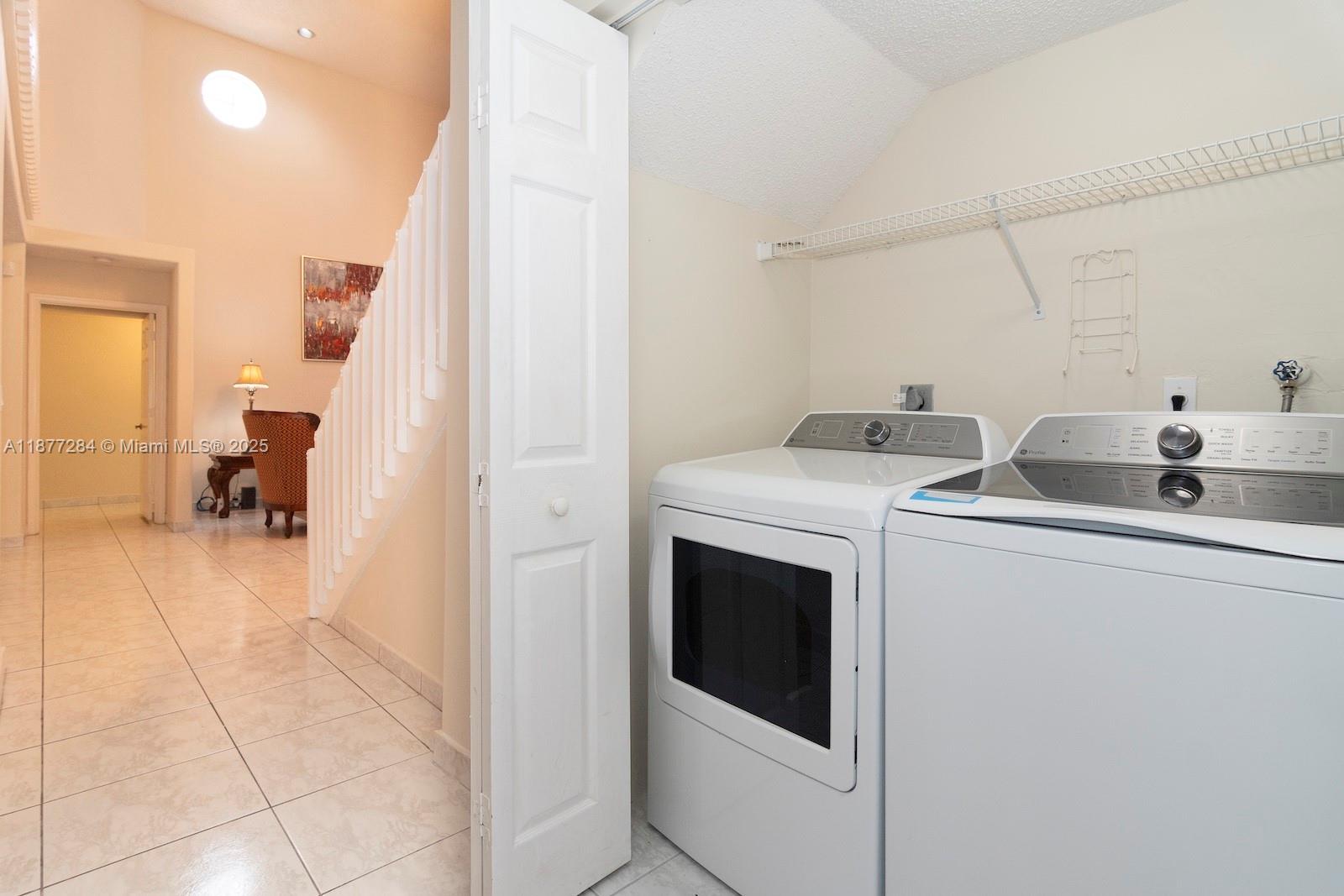 2293 Southwest 182nd Way Miramar, FL 33029 - Photo 24 of 41 a utility room with dryer and washer