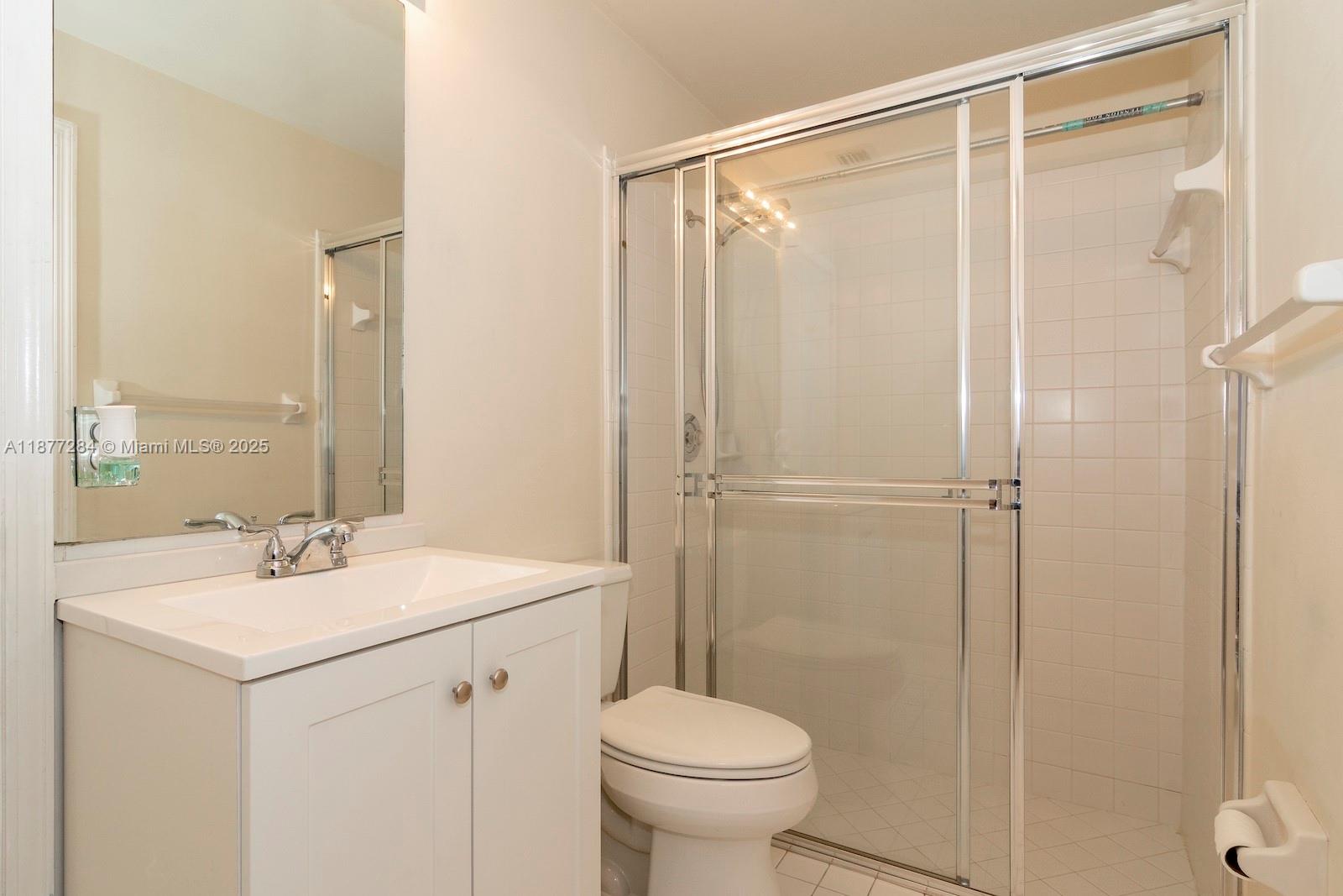 2293 Southwest 182nd Way Miramar, FL 33029 - Photo 25 of 41 a bathroom with a sink a toilet and shower