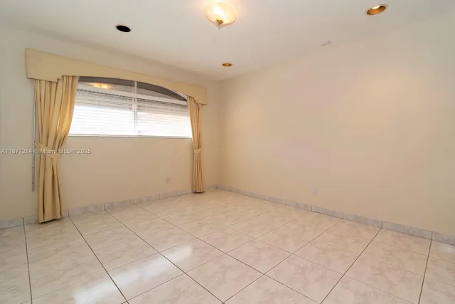 a bathroom with a sink mirror and toilet