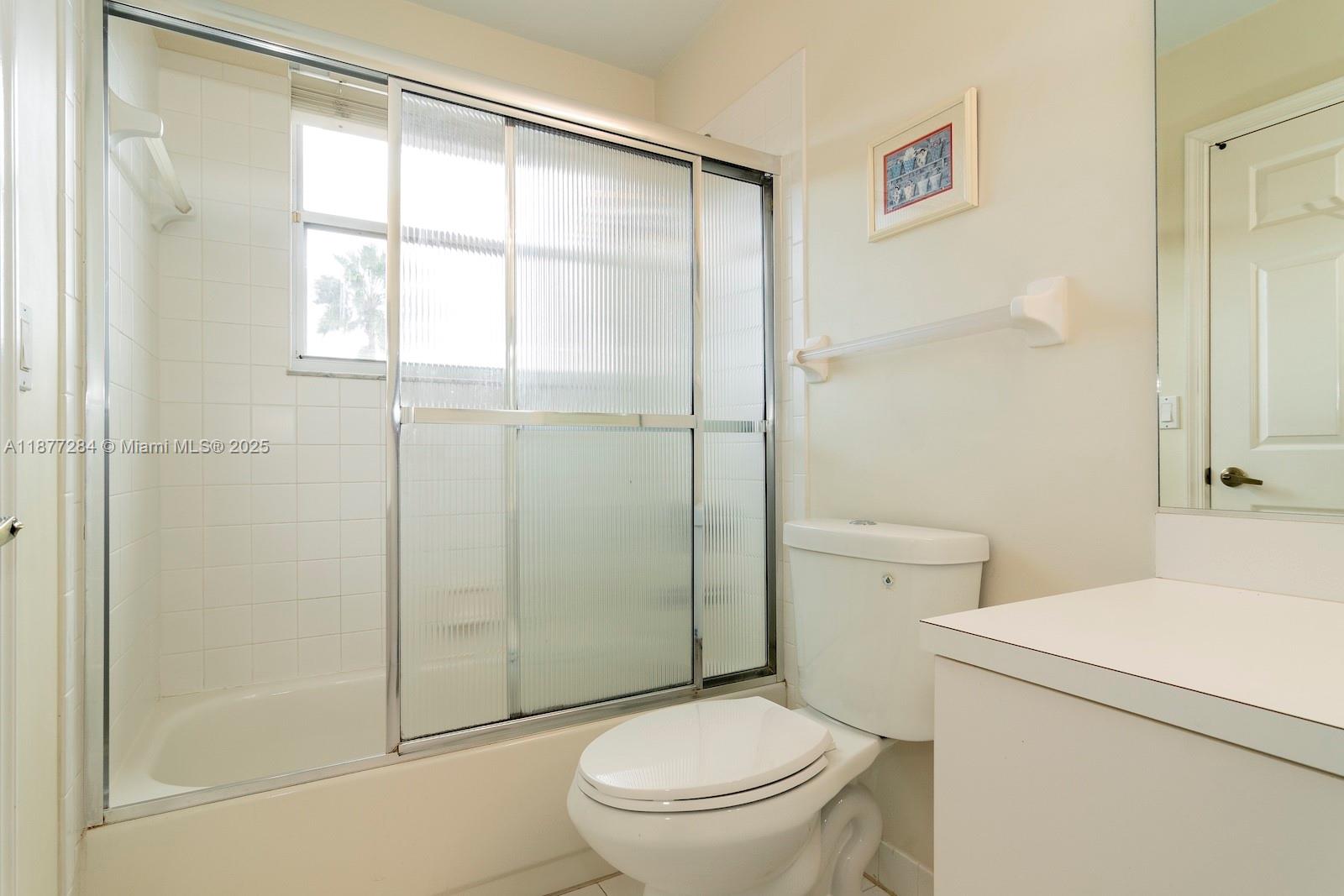 2293 Southwest 182nd Way Miramar, FL 33029 - Photo 31 of 41 a bathroom with a toilet and a shower