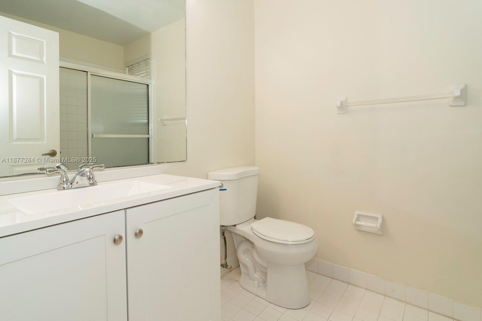 2293 Southwest 182nd Way Miramar, FL 33029 - Photo 33 of 41 a bathroom with a sink a toilet and a mirror