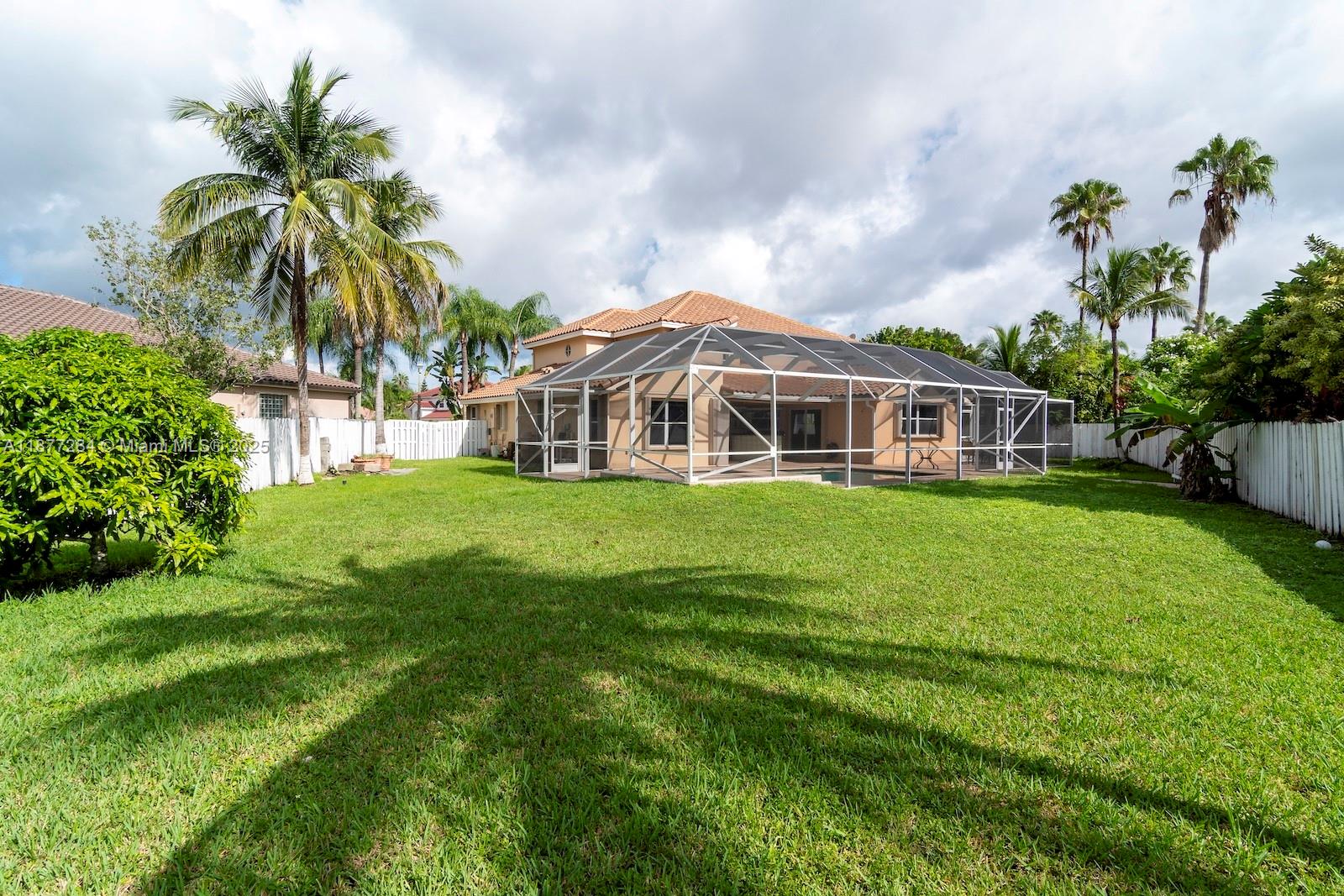 2293 Southwest 182nd Way Miramar, FL 33029 - Photo 39 of 41 a view of a house with a big yard and potted plants