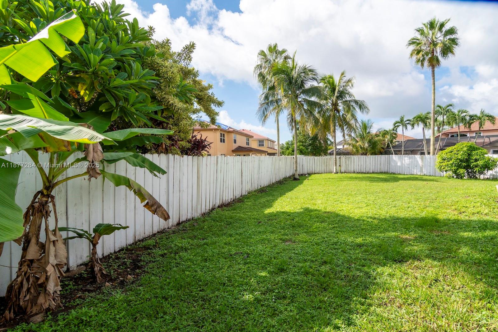 2293 Southwest 182nd Way Miramar, FL 33029 - Photo 40 of 41 a view of a backyard with a tree