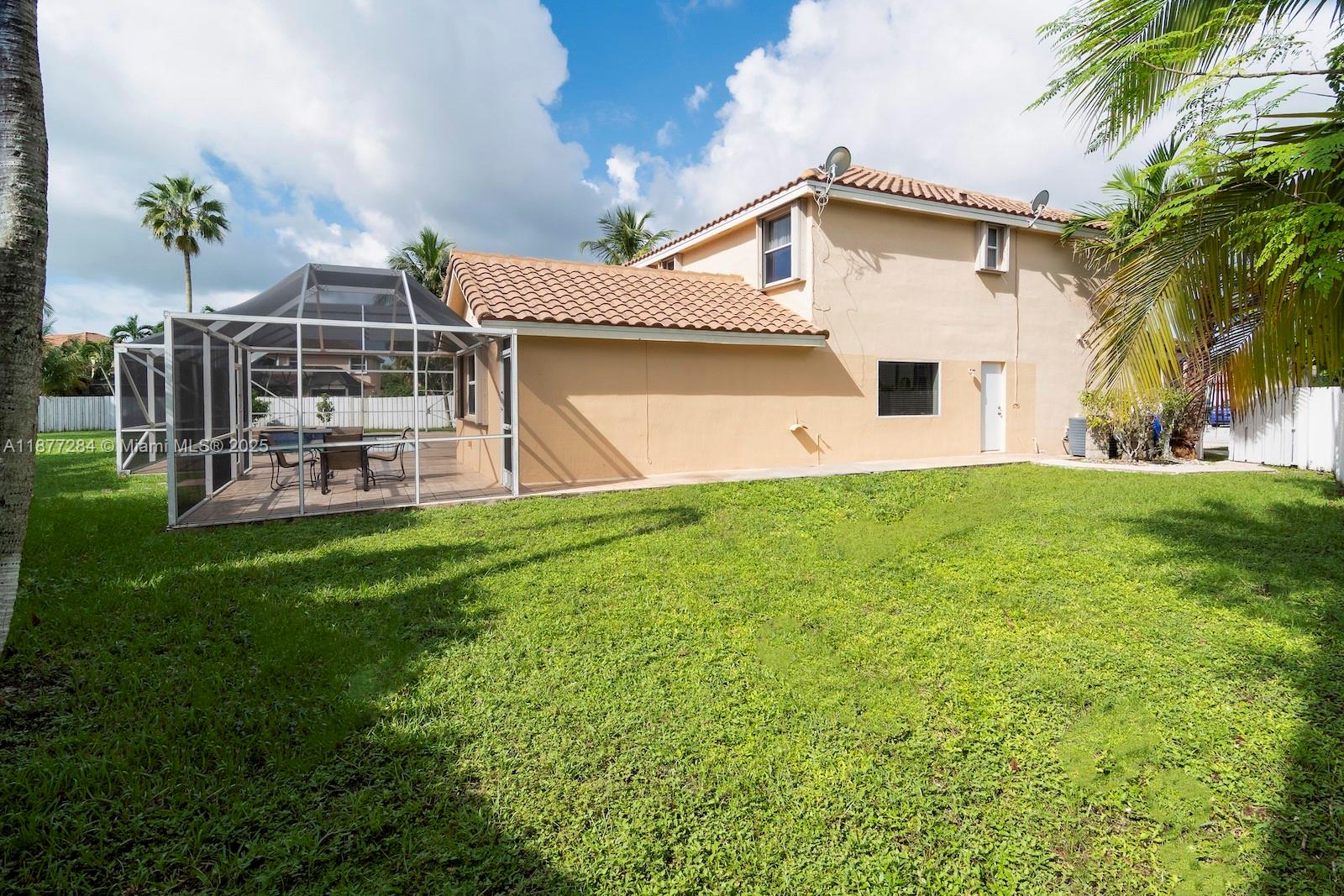 2293 Southwest 182nd Way Miramar, FL 33029 - Photo 41 of 41 a front view of a house with a yard