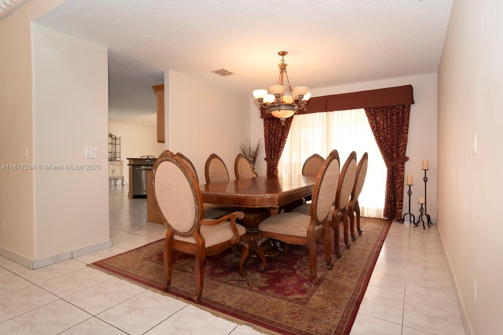 2293 Southwest 182nd Way Miramar, FL 33029 - Photo 8 of 41 a dining room with furniture and window