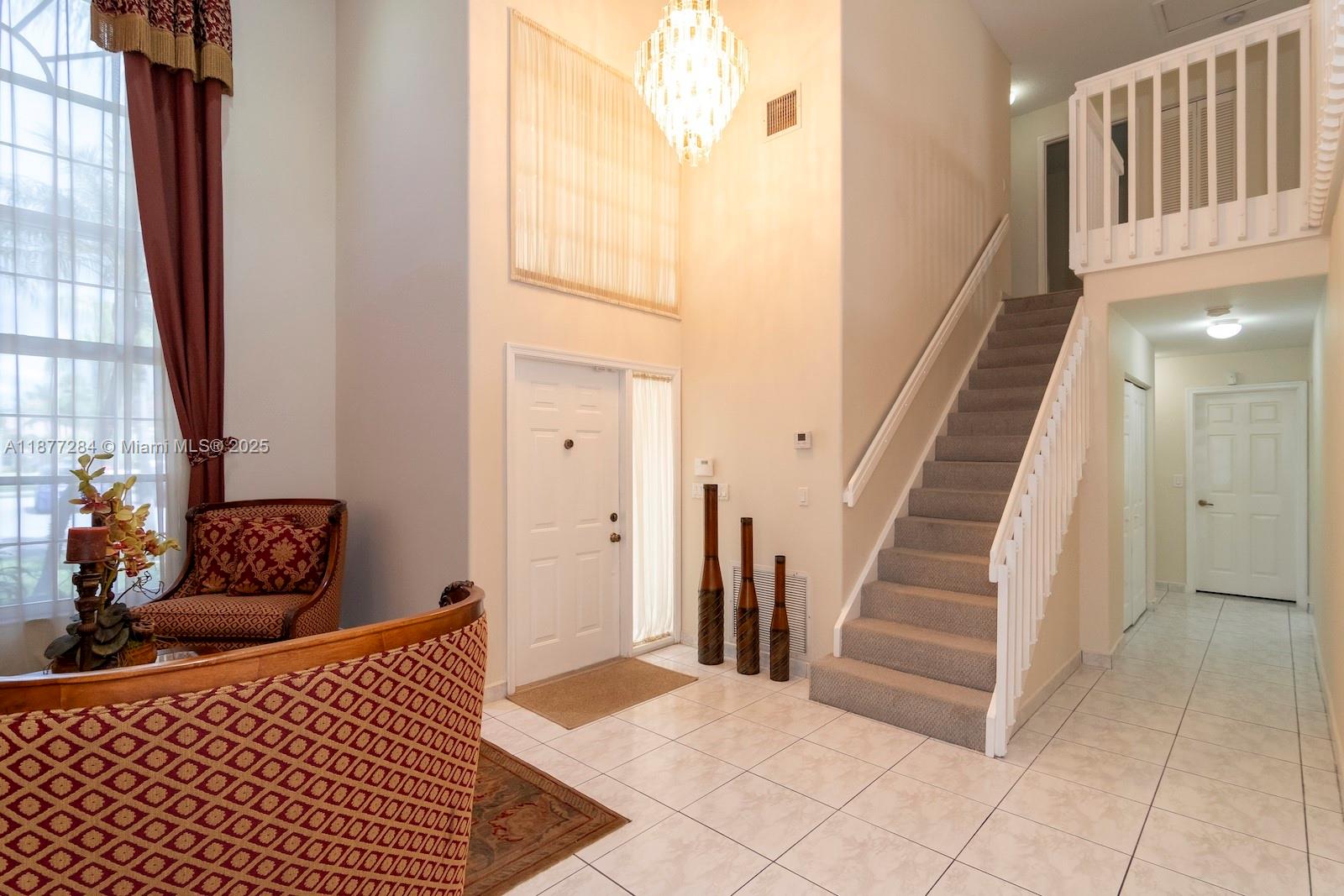 2293 Southwest 182nd Way Miramar, FL 33029 - Photo 9 of 41 a bedroom with furniture and a window