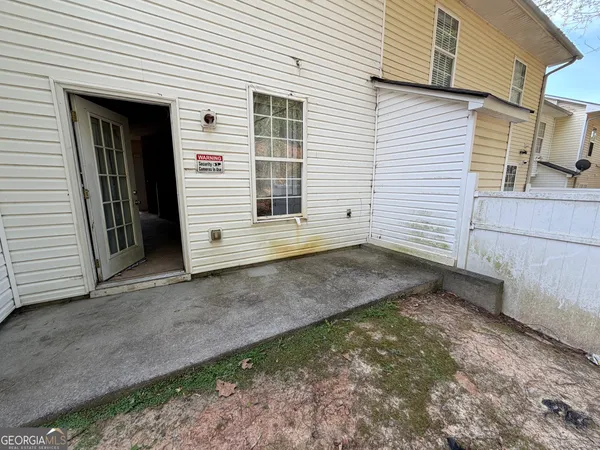 a view of a backyard of the house