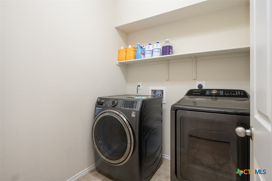 2511 Pintail Loop Copperas Cove, TX 76522 - Photo 23 of 26 a utility room with dryer and washer