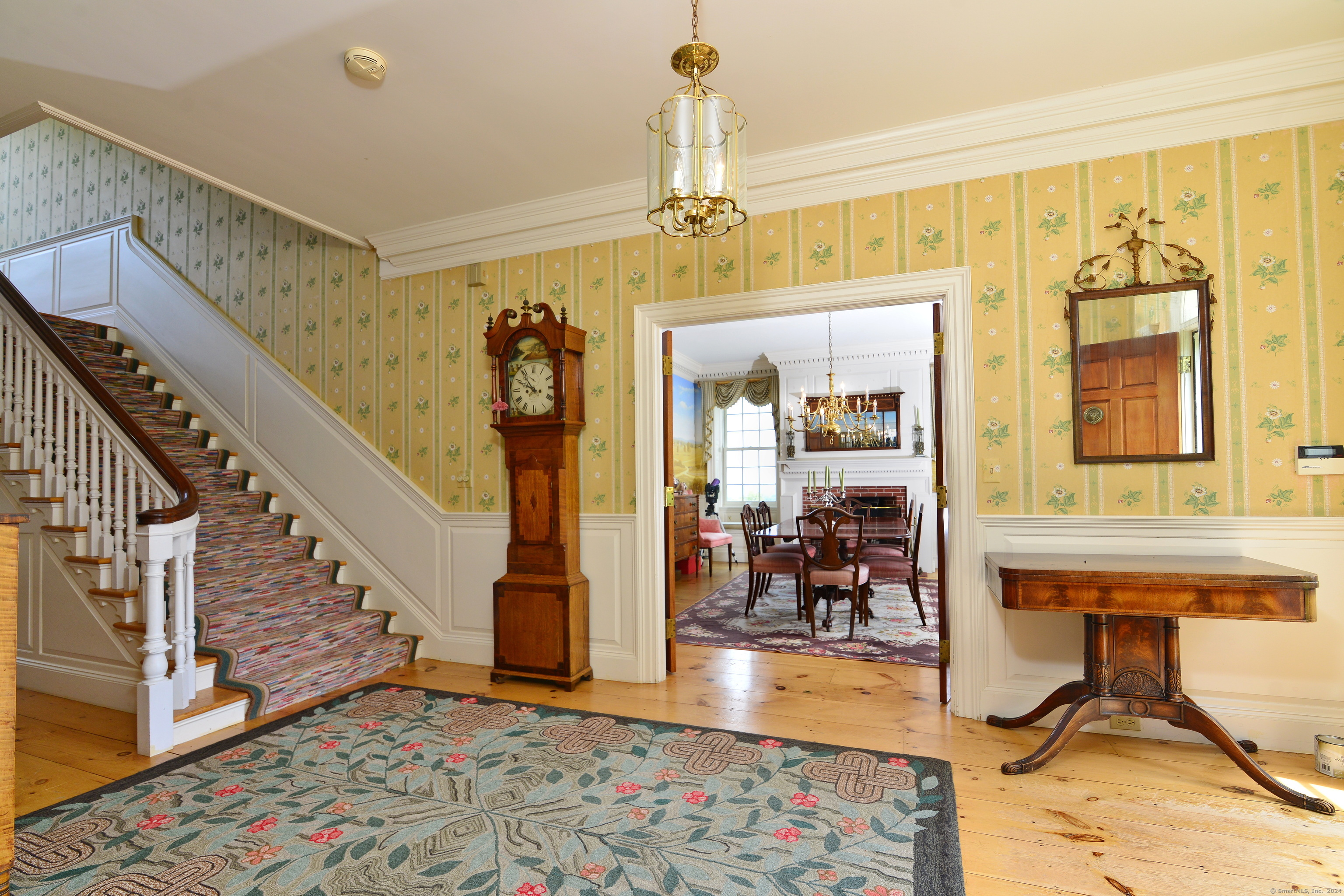175 Pulpit Rock Road Woodstock, CT 06281 - Photo 12 of 39 Grand crown moulding and wainscoting adorn the expansive foyer and staircase.