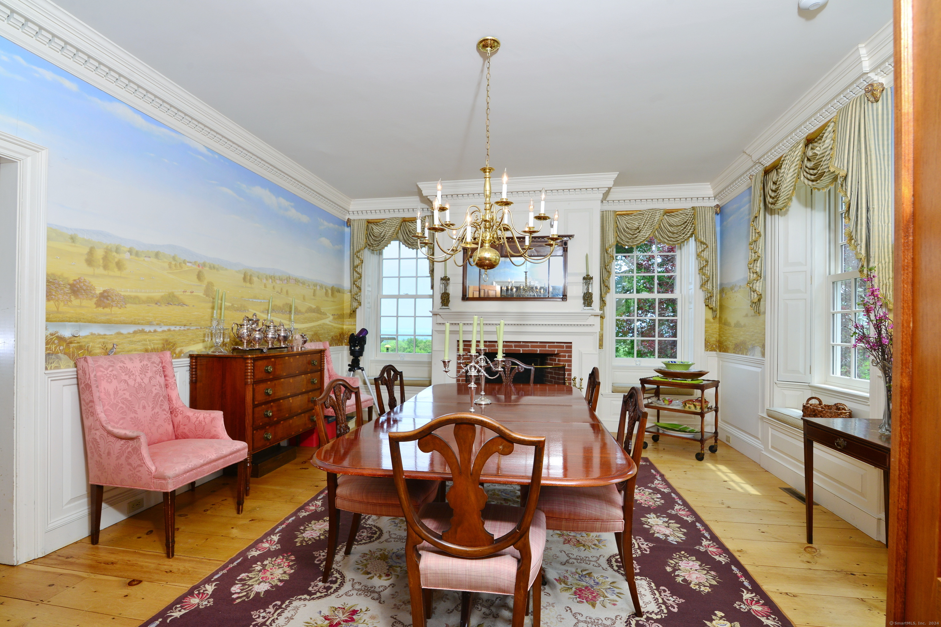 175 Pulpit Rock Road Woodstock, CT 06281 - Photo 16 of 39 Extraordinary formal dining room characterized by hand-milled woodwork detail, fireplace, and hand-painted murals of the Woodstock countryside by one of the finest local artists.
