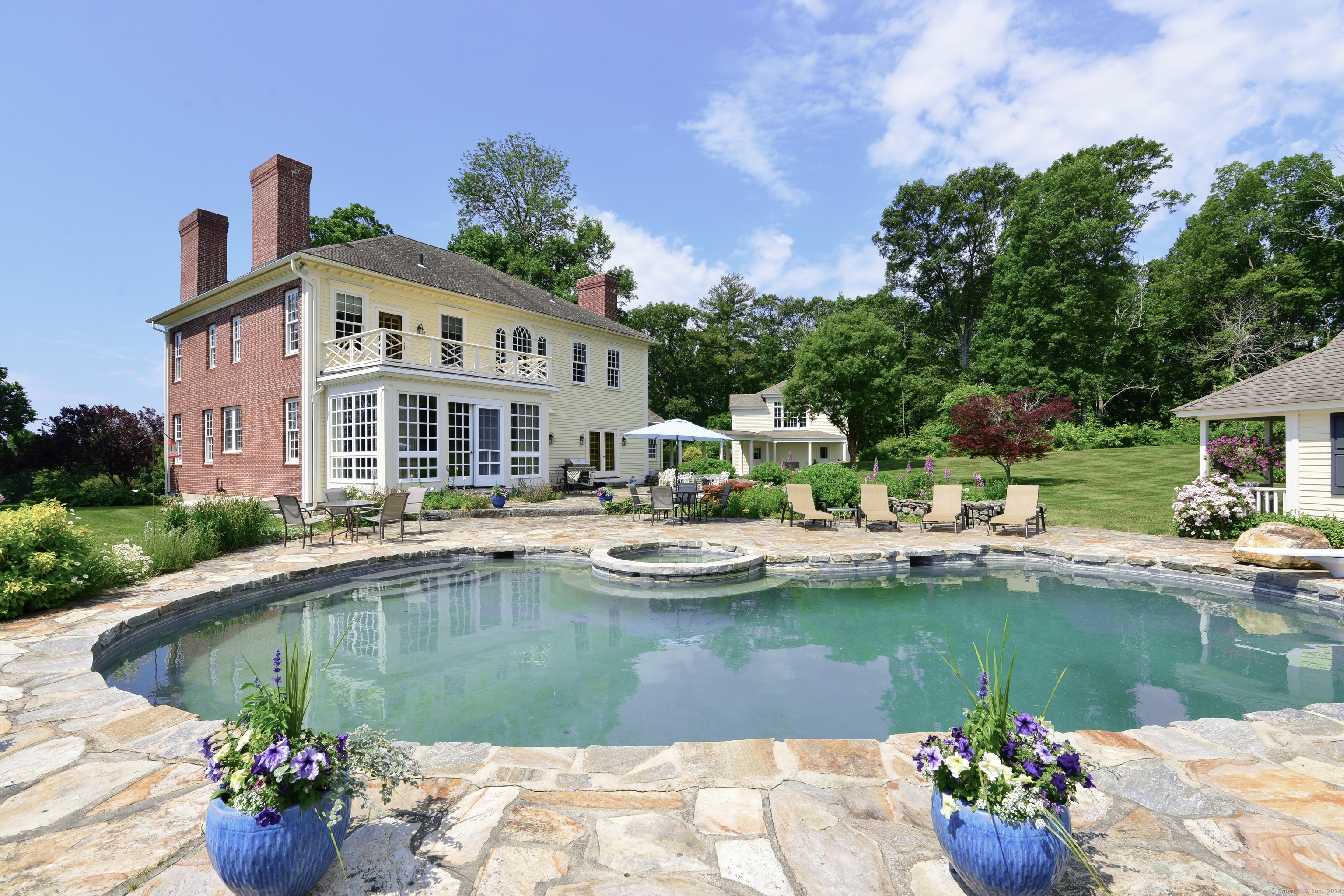 175 Pulpit Rock Road Woodstock, CT 06281 - Photo 2 of 39 Dream saltwater pool with patios, outdoor fireplace, and pool house.