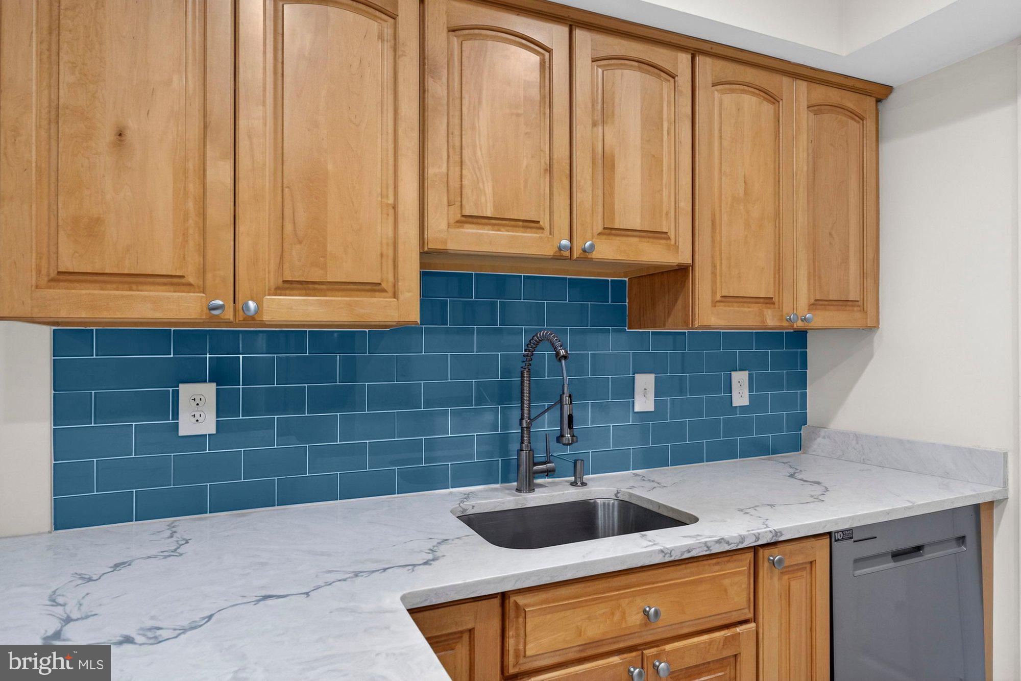 207 Park Street Vienna, VA 22180 - Photo 17 of 45 a kitchen with a sink and cabinets