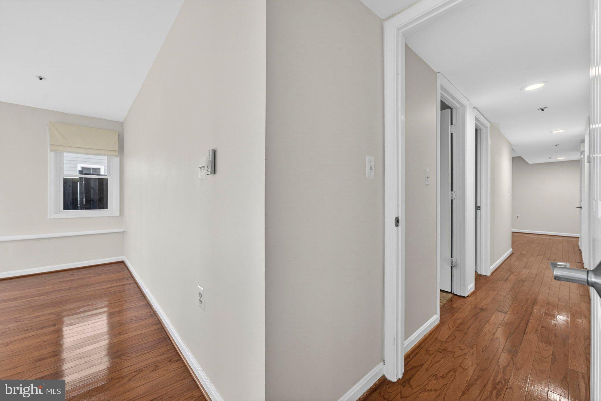 207 Park Street Vienna, VA 22180 - Photo 20 of 45 a view of a hallway with wooden floor and staircase