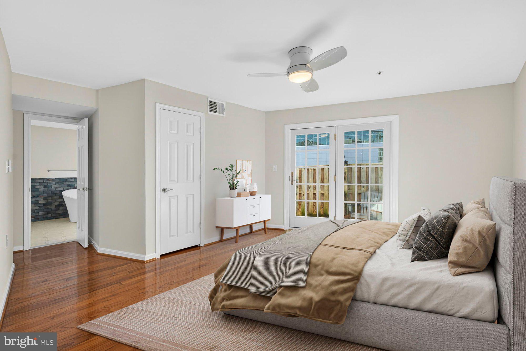 207 Park Street Vienna, VA 22180 - Photo 2 of 45 a bedroom with a bed and a large window