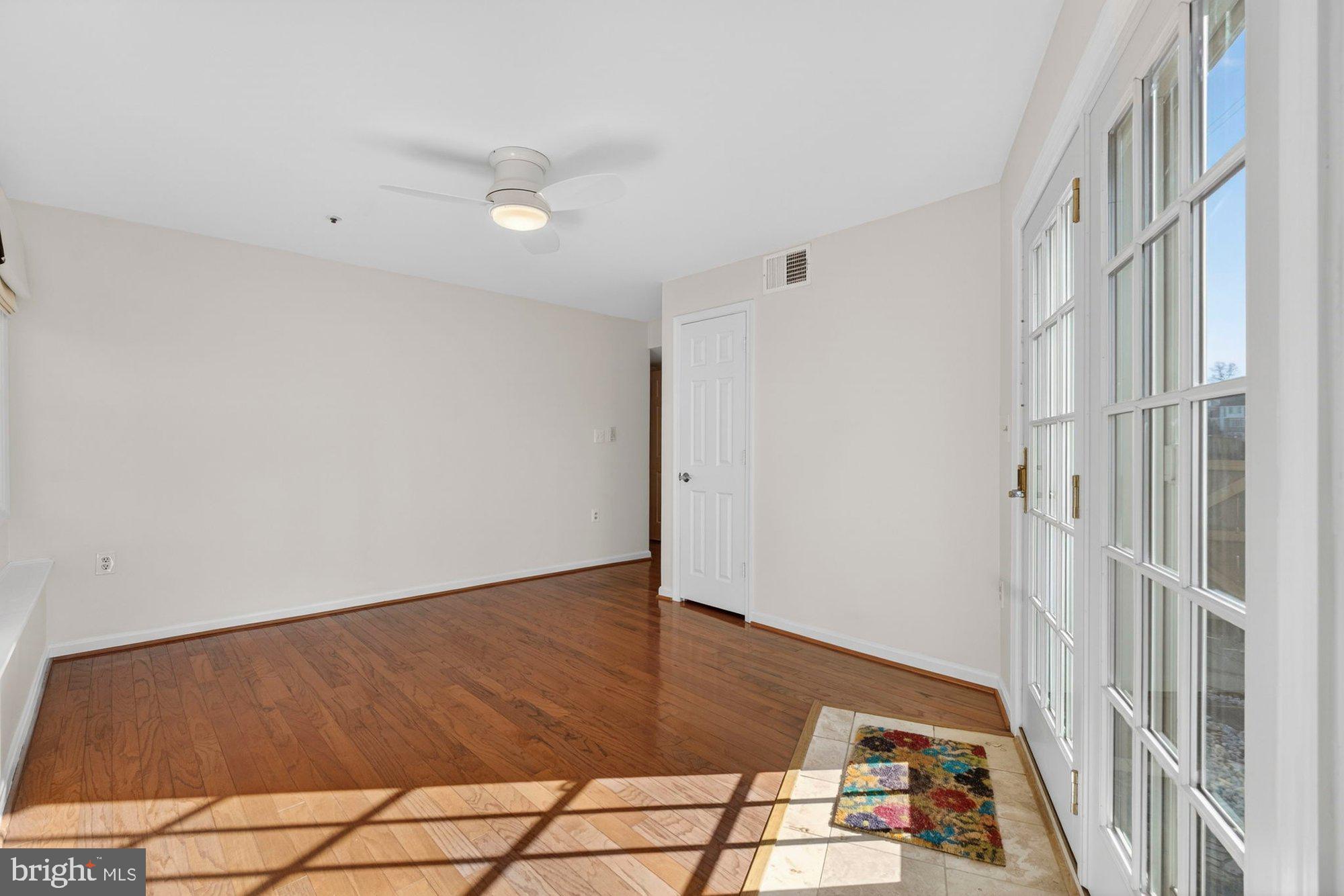 207 Park Street Vienna, VA 22180 - Photo 22 of 45 an empty room with wooden floor