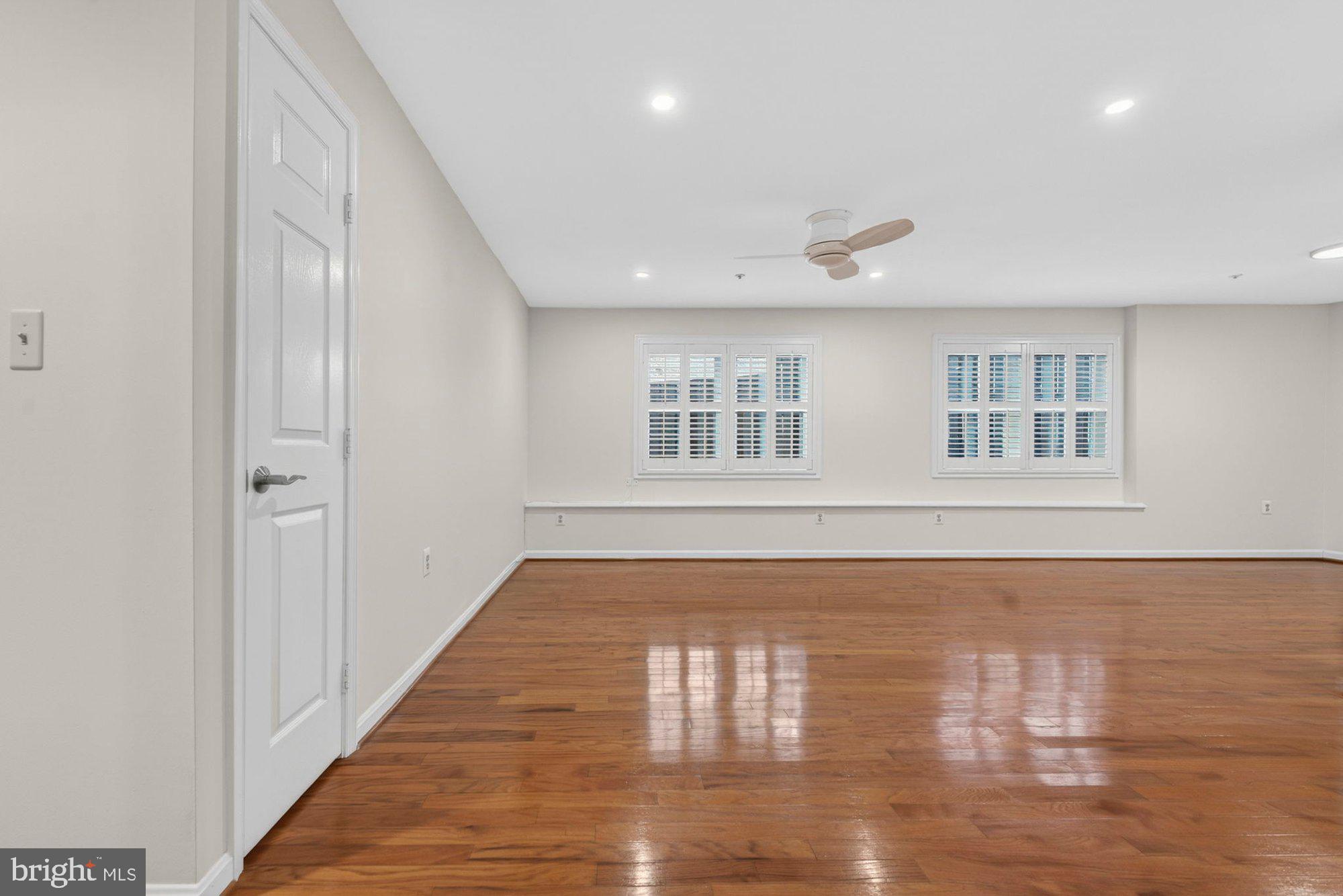 207 Park Street Vienna, VA 22180 - Photo 7 of 45 a view of empty room with wooden floor and fan
