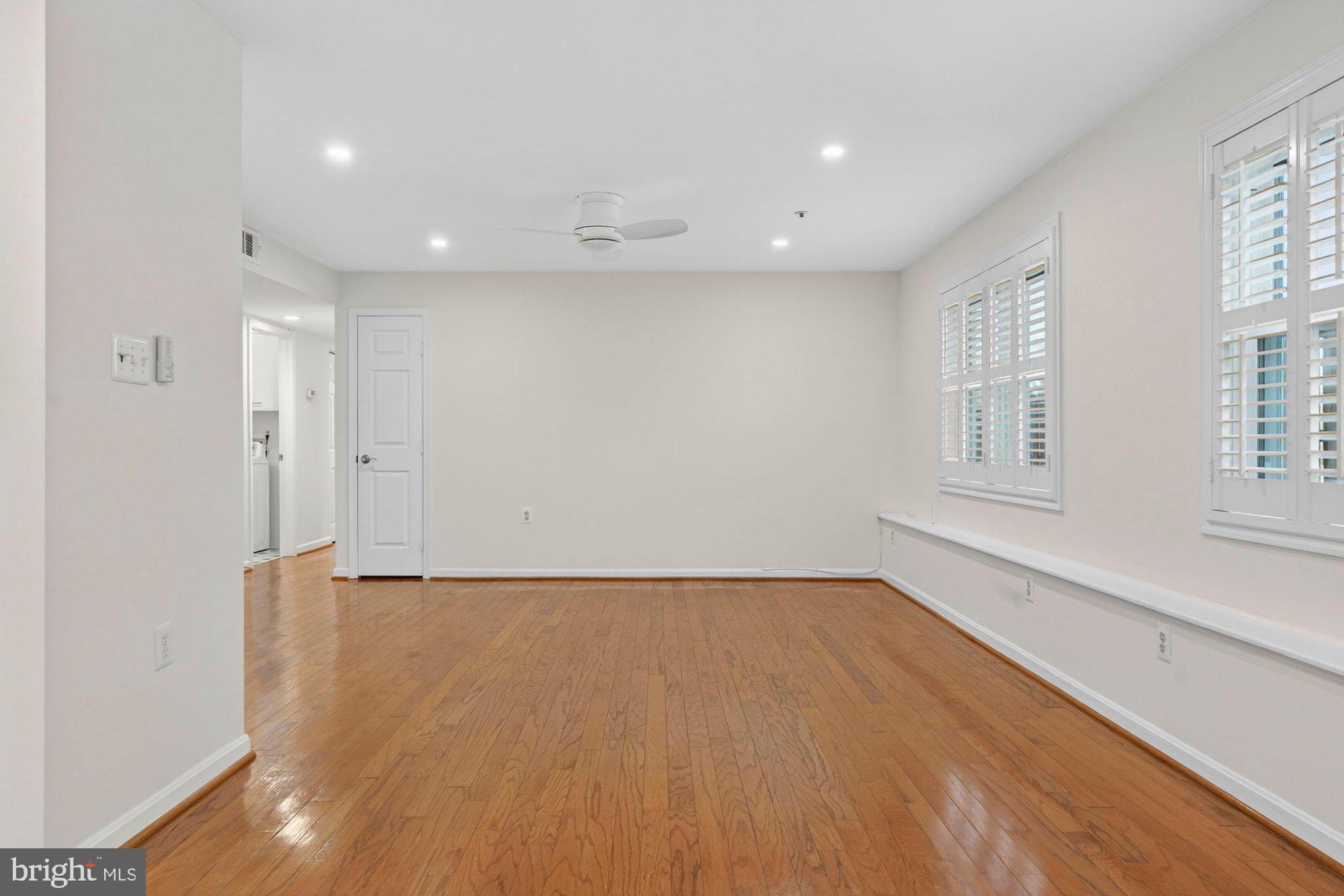 207 Park Street Vienna, VA 22180 - Photo 10 of 45 a view of an empty room with wooden floor and a window