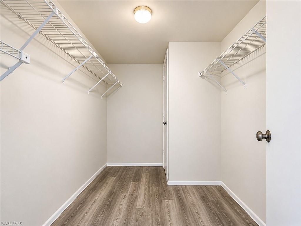 5635 Rattlesnake Hammock Road, Unit D203 Naples, FL 34113 - Photo 6 of 23 Primary Closet