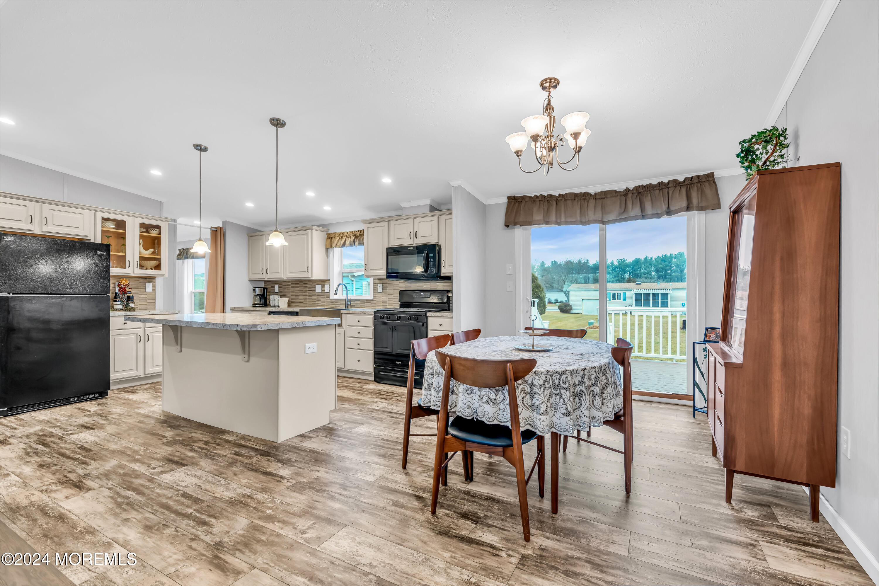 602 Jerome Place Freehold, NJ 07728 - Photo 17 of 55 a kitchen with refrigerator a sink and chairs