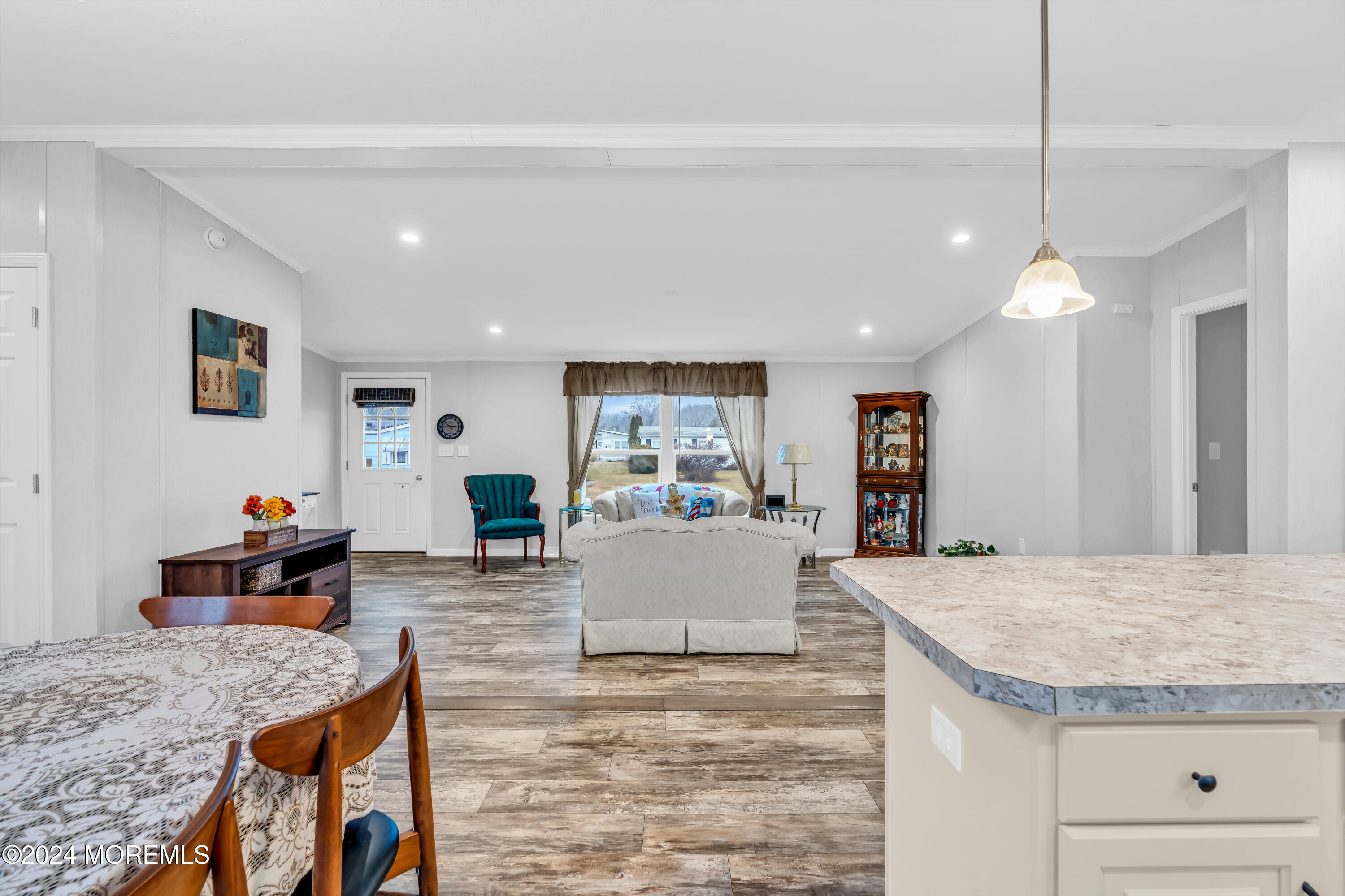 602 Jerome Place Freehold, NJ 07728 - Photo 20 of 55 a living room with kitchen island furniture and a kitchen view
